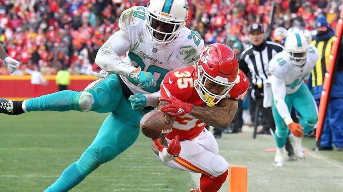 Kansas City Chiefs running back Charcandrick West was knocked out of bounds by Miami Dolphins free safety Reshad Jones at the 1 in the fourth quarter December 24, 2017 at Arrowhead Stadium in Kansas City, Mo.