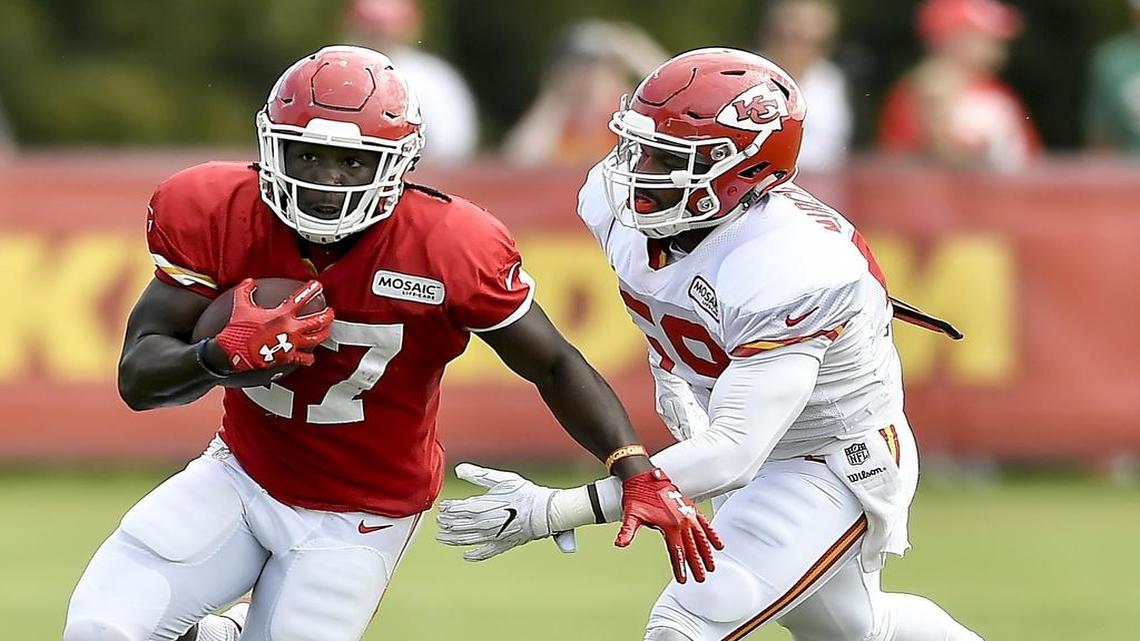 Kansas City Chiefs running back Kareem Hunt (left) ran past Justin March-Lillard during a training-camp practice.