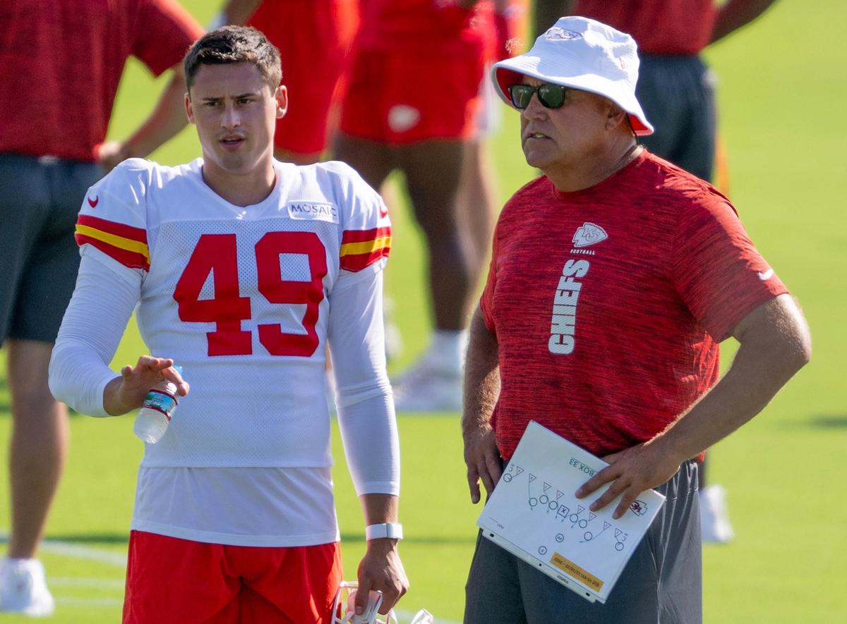 Kansas City Chiefs punter Matt Araiza (49) speaks with assistant head coach and special teams coordinator Dave Toub during practice at Chiefs training camp on Wednesday, July 17, 2024, in St. Joseph.