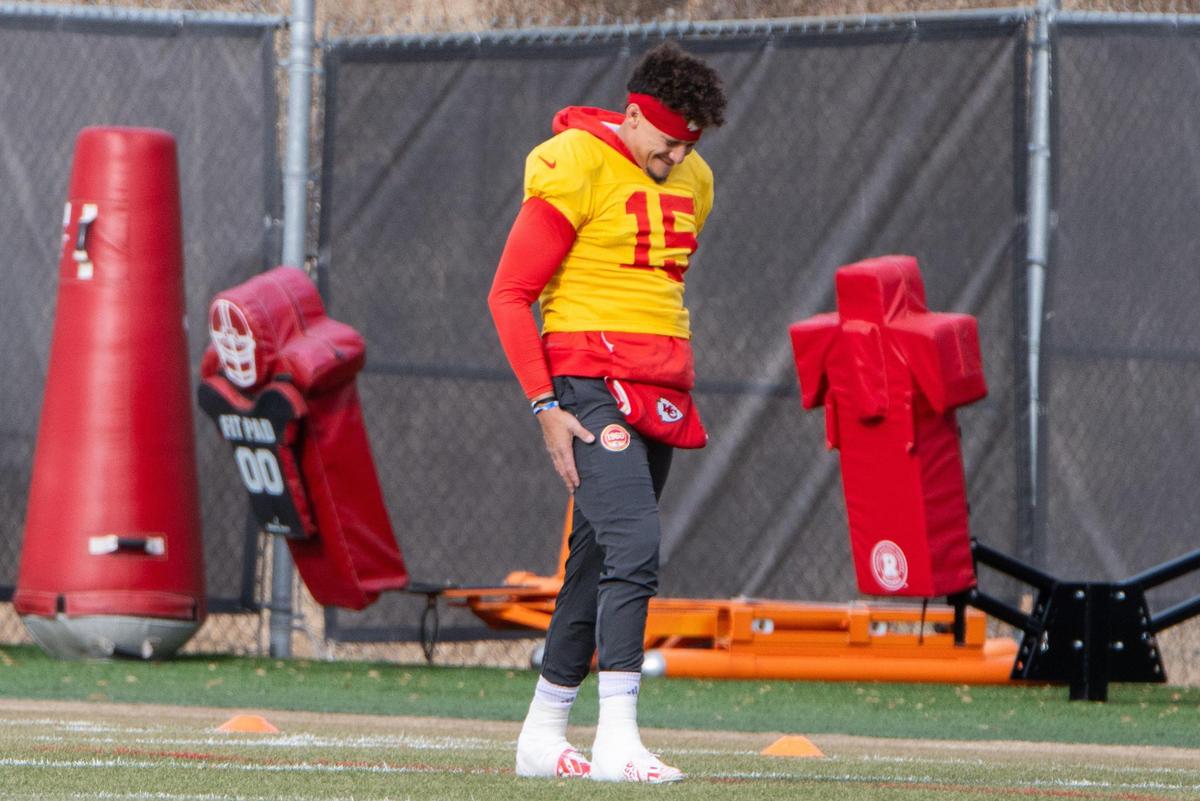 Kansas City Chiefs quarterback Patrick Mahomes stretches his injured ankle at Chiefs practice on Tuesday, Dec. 17, 2024.