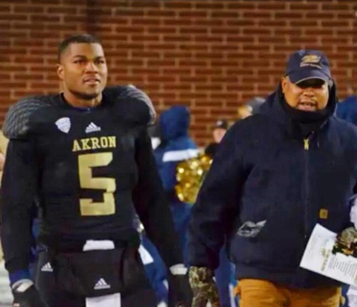 Justin March-Lillard and his father, Randy Lillard Sr., during Akron’s Senior Night.