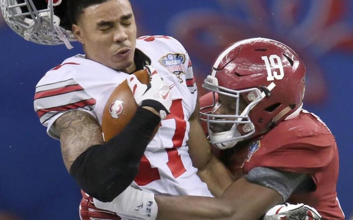 Reggie Ragland was known for his hard hitting at Alabama, as evident in this tackle of Ohio State’s Jalin Marshall in the college football semifinals on Jan. 1, 2015.