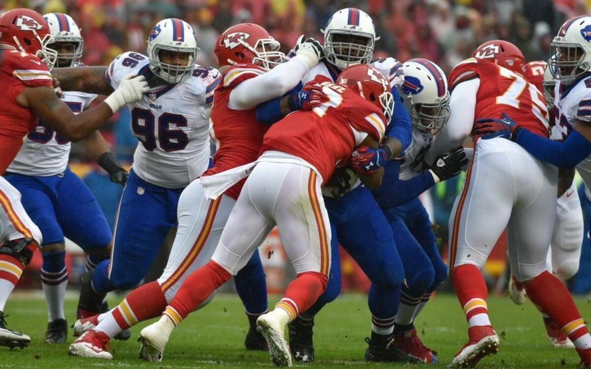 Chiefs running back Spencer Ware (32) was tackled after a short run in the first half of Sunday's NFL game against the Bills at Arrowhead Stadium.