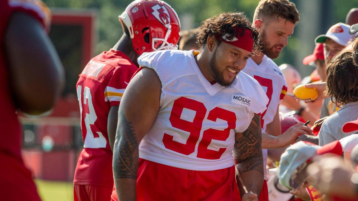 Kansas City Chiefs defensive tackle Danny Shelton (92) signs autographs for fans after the last day of practice at Chiefs training camp on Thursday, Aug. 18, 2022, in St. Joseph.
