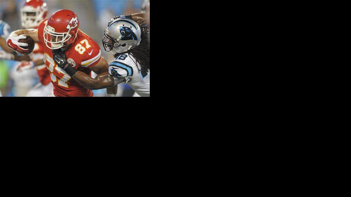 
Kansas City Chiefs' Travis Kelce catches a touchdown pass against Carolina Panthers' Robert Lester in the second half of Sunday’s game in Charlotte, N.C.
