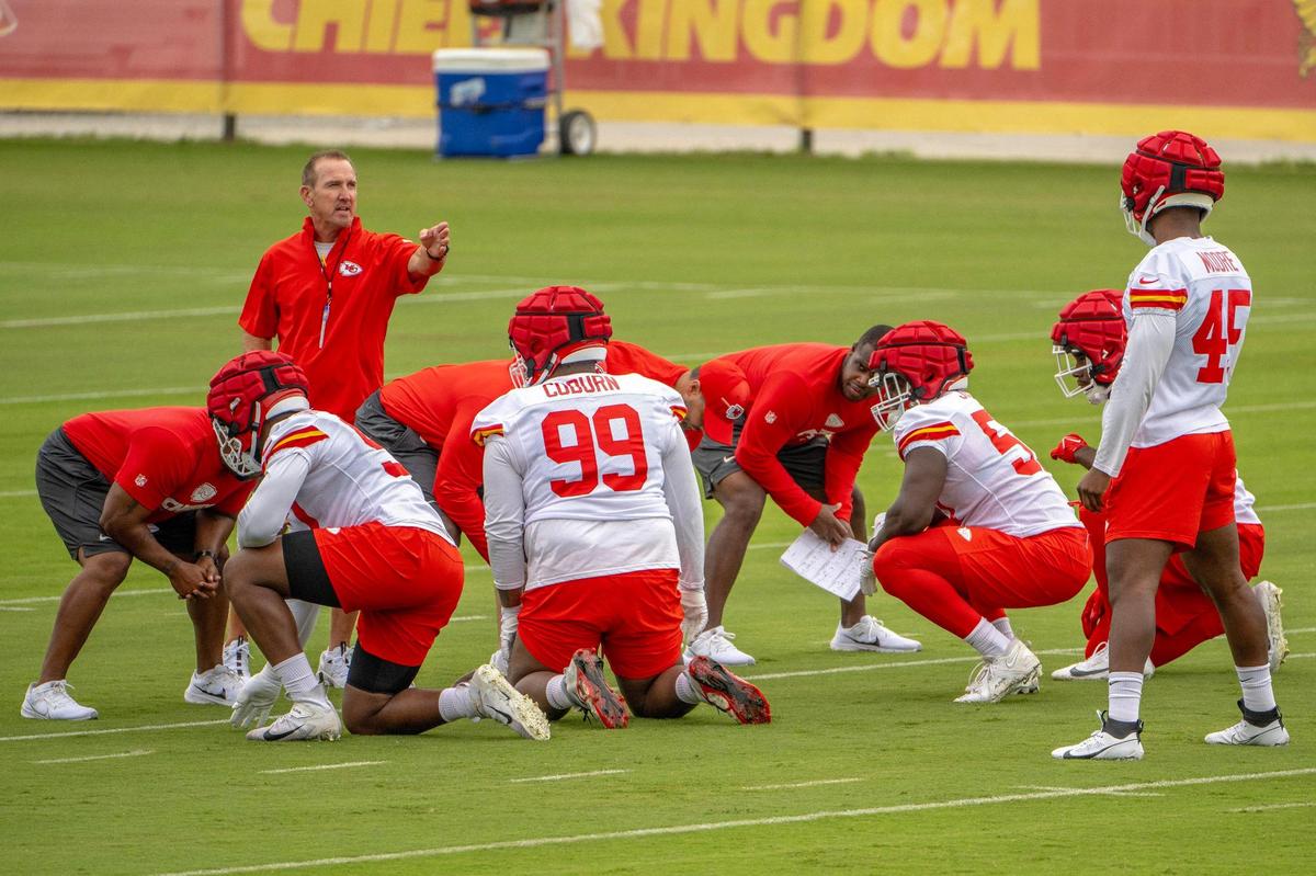 Chiefs defensive coordinator Steve Spagnuolo helps players run through drills at practice during Chiefs training camp on Friday, July 21, 2023, in St. Joseph, Mo.