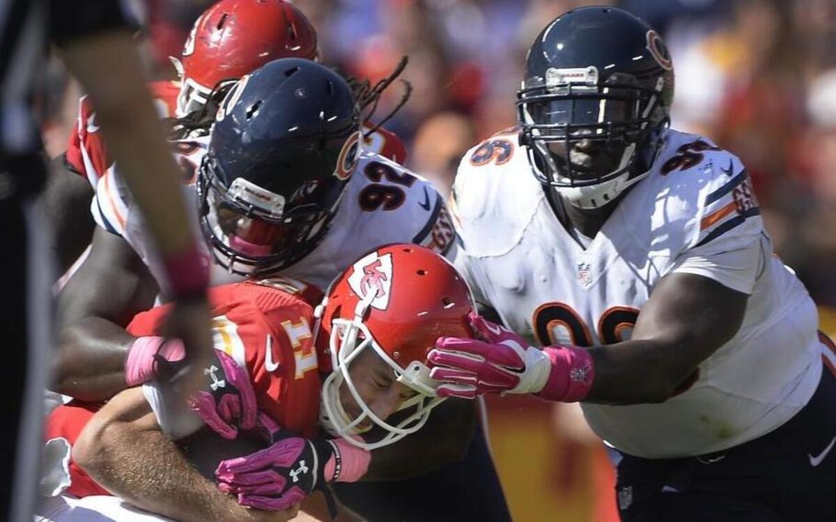 Jarvis Jenkins, top right, was with the Chicago Bears last fall when he got in on this sack of Chiefs quarterback Alex Smith at Arrowhead Stadium. On Monday, Jenkins signed with KC, according to his agent.