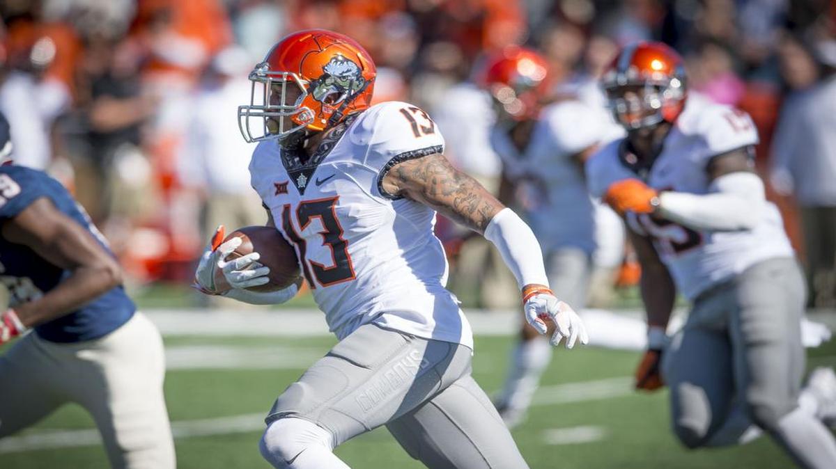 Oklahoma State safety Jordan Sterns (center) did not get picked in the 2017 NFL Draft, but he will get a chance to make his case with the Chiefs.