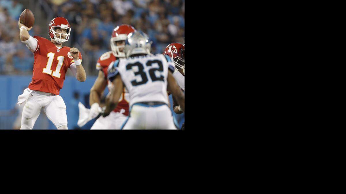 
The Chiefs’ Alex Smith (11) looked to pass against the Carolina Panthers in the first half Sunday night in Charlotte, N.C. The Chiefs lost the preseason game 28-16.
