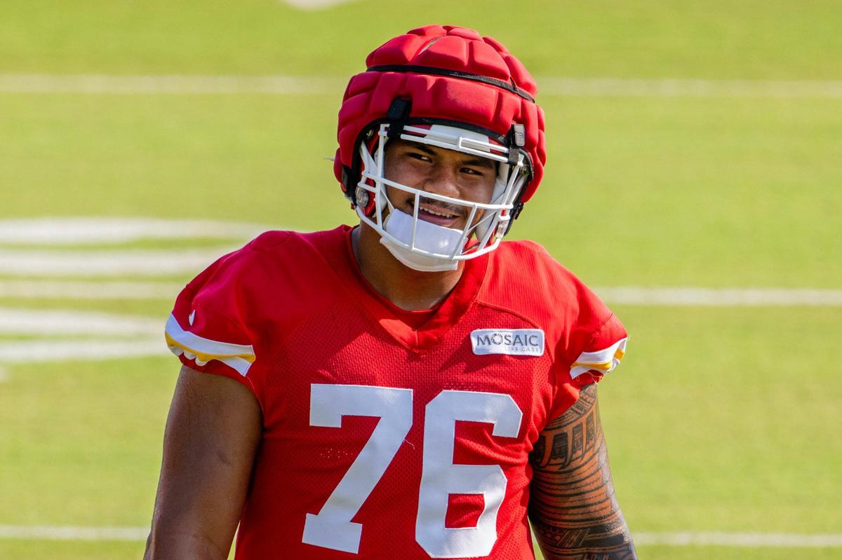 Kansas City Chiefs offensive tackle Kingsley Suamataia (76) smiles as he warms up during practice at Chiefs training camp on Monday, July 29, 2024, in St. Joseph.