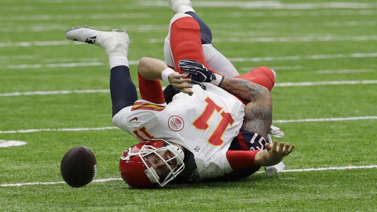 Chiefs quarterback Alex Smith fumbled as he was sacked by Houston outside linebacker John Simon during the first half Sunday. Smith lost two fumbles in the Chiefs’ 19-12 loss.