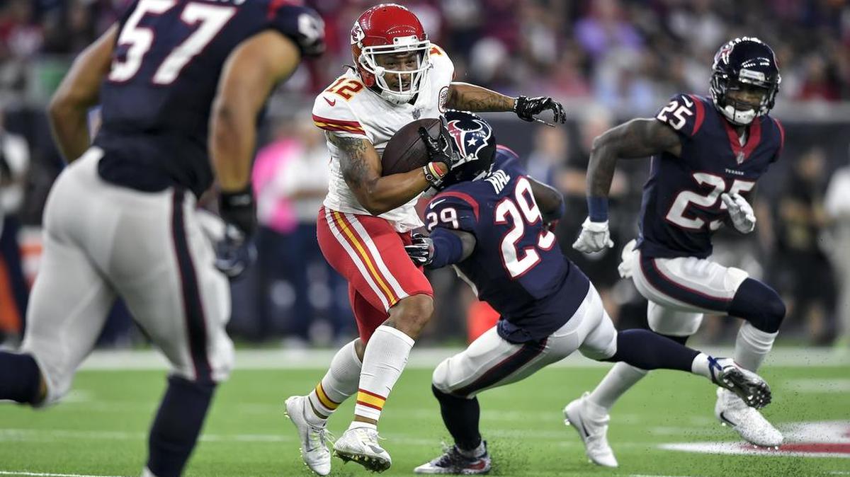 Kansas City Chiefs wide receiver Albert Wilson (12) gained 12 yards on a third-quarter pass, eluding Houston Texans free safety Andre Hal (29) on Sunday night, Oct. 8, 2017, at NRG Stadium in Houston, Texas.