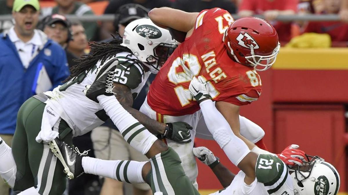 Kansas City Chiefs tight end Travis Kelce ran through New York’s Calvin Pryor and Marcus Gilchrist during Sunday’s game.