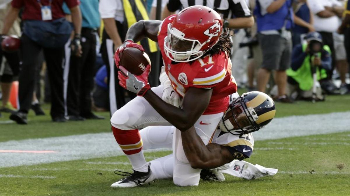 Kansas City Chiefs wide receiver Chris Conley was dragged down by Los Angeles Rams cornerback Trumaine Johnson during the first half of Saturday’s game.