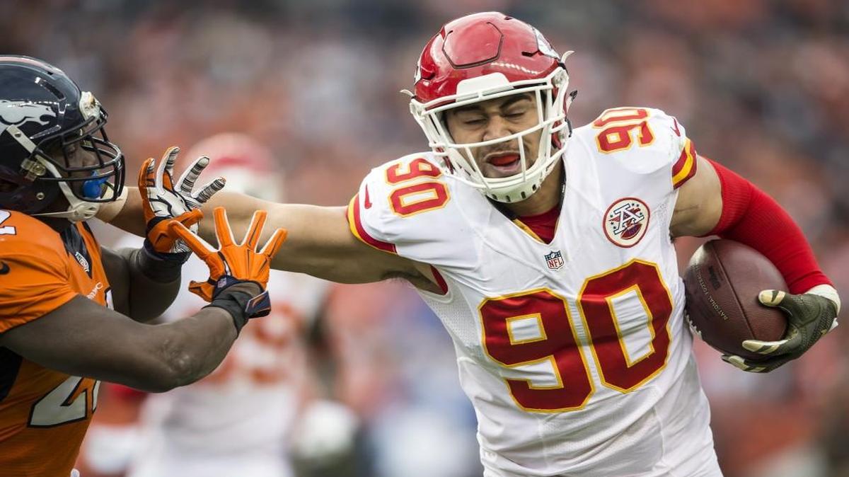 Kansas City Chiefs inside linebacker Josh Mauga returned a second-quarter interception while pushing away Denver Broncos running back C.J. Anderson during Sunday’s game.