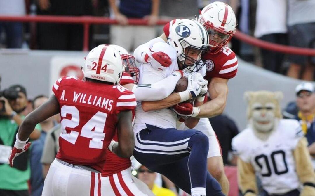 BYU wide receiver Mitch Mathews (center) caught the game-winning touchdown amongst a trio of Nebraska players as time ran out during a game last September..
