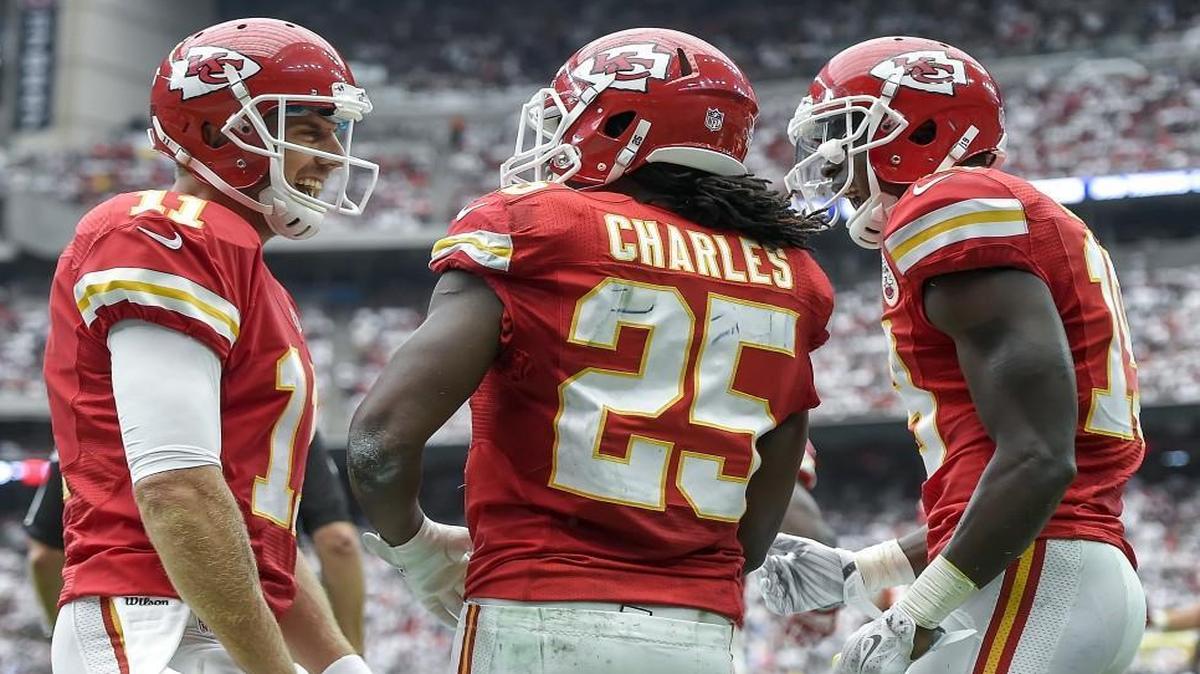 
Chiefs quarterback Alex Smith (11) celebrated with running back Jamaal Charles (25) and wide receiver Jeremy Maclin (19) after Charles scored on a 7-yard pass during their Sept. 13 game against the Texans in Houston. The Chiefs won 27-20.
