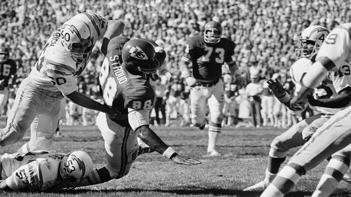 Tight end Morris Stroud, being taken down by a pair of Chargers during an Oct. 11, 1971 game, was a tall target for quarterback Len Dawson during his career with the Chiefs.