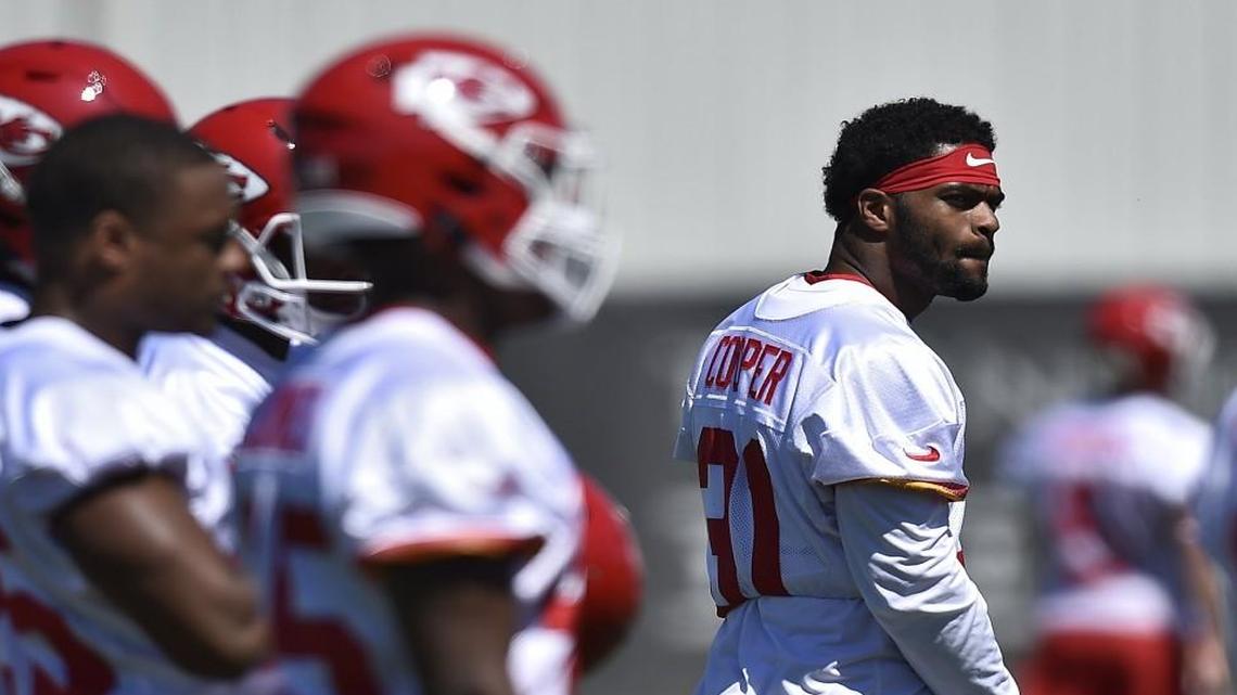 Marcus Cooper, right, has been sliding from cornerback to safety during the Chiefs’ offseason workouts.