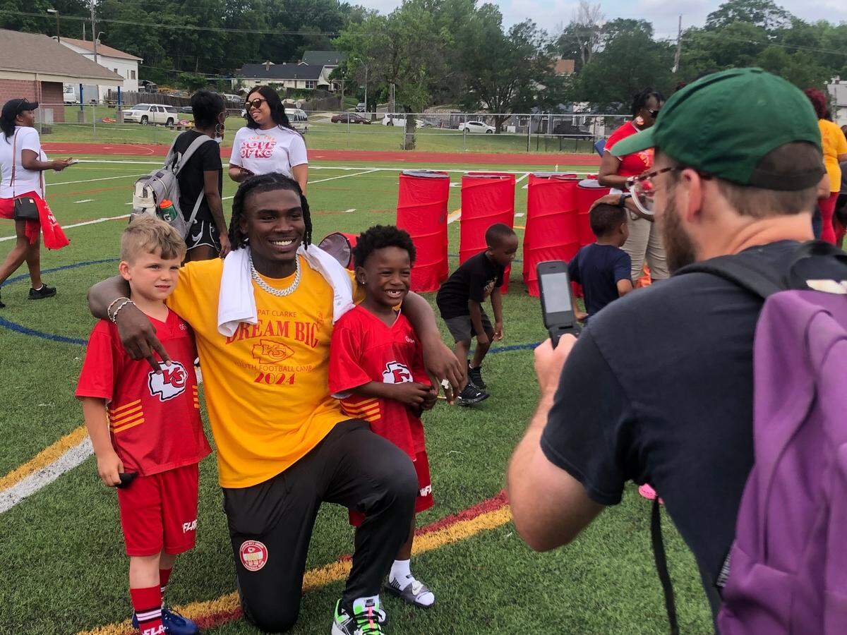 Kansas City Chiefs receiver Rashee Rice, center, poses for a photo with six-year-old Jacob Comiskey (left) and five-year-old Da’mon Gwinn Jr., both of Kansas City, Missouri. Rice worked with campers at Pat Clarke’s “Dream Big” youth football camp on Saturday, June 8, 2024, at Central High School in Kansas City, Missouri.