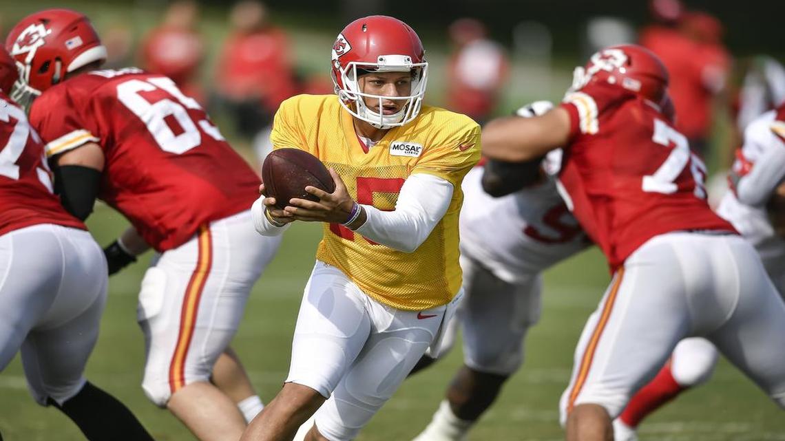 Kansas City Chiefs quarterback Patrick Mahomes (15) readied the ball for a handoff during Tuesday’s team training camp practice in St. Joseph.