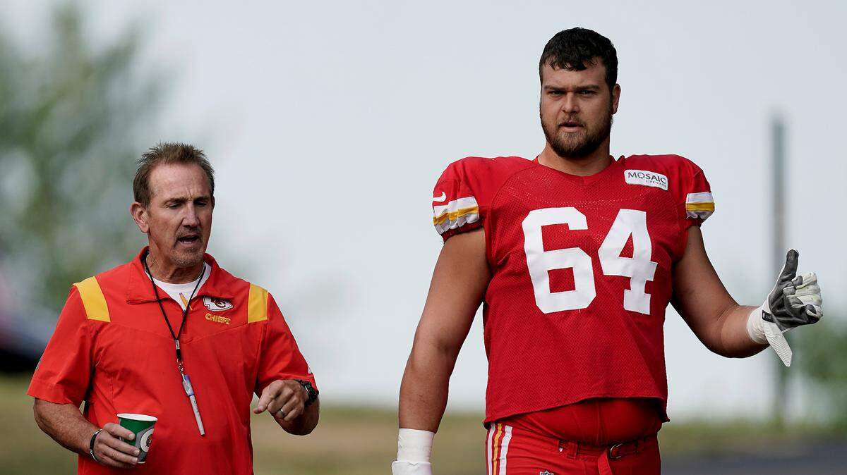 Kansas City Chiefs offensive tackle David Steinmetz (64) and defensive coordinator Steve Spagnuolo arrive at NFL football training camp Monday, Aug. 15, 2022, in St. Joseph, Mo.
