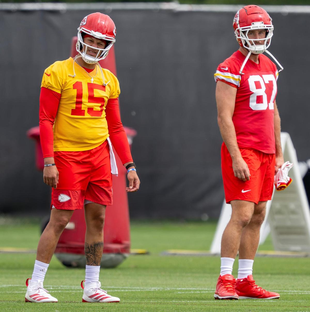 Kansas City Chiefs quarterback Patrick Mahomes (15) and tight end Travis Kelce (87) stretch during minicamp at the team’s training facility on Wednesday, June 18, 2025, in Kansas City.