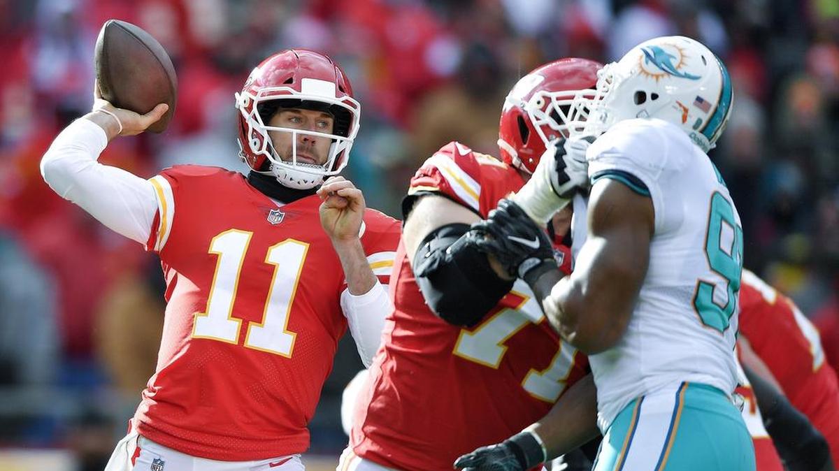 Chiefs quarterback Alex Smith (left) got solid protection from the line on Sunday in the division-clinching home victory over the Miami Dolphins.