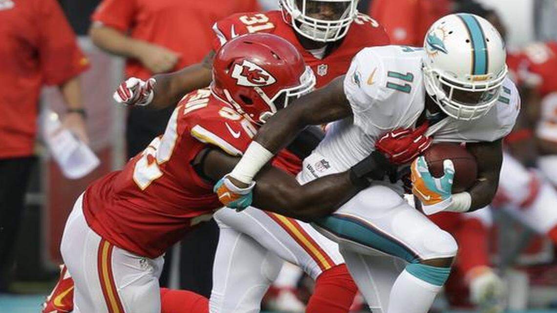 
Kansas City Chiefs inside linebacker James-Michael Johnson tackled Miami receiver Mike Wallace in Sunday’s game.
