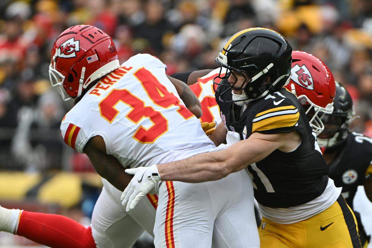 Pittsburgh Steelers linebacker Payton Wilson (41) tackles Kansas City Chiefs running back Samaje Perine (34) during the second quarter on Dec. 25, 2024, at Acrisure Stadium in Pittsburgh.