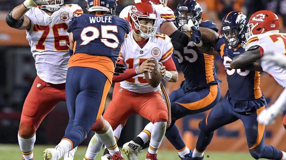 Kansas City Chiefs quarterback Patrick Mahomes scrambles out of the pocket before making a first down throw to tight end Travis Kelce in the third quarter during Monday’s football game against the Denver Broncos on October 1, 2018 at Mile High Stadium in Denver, Colorado