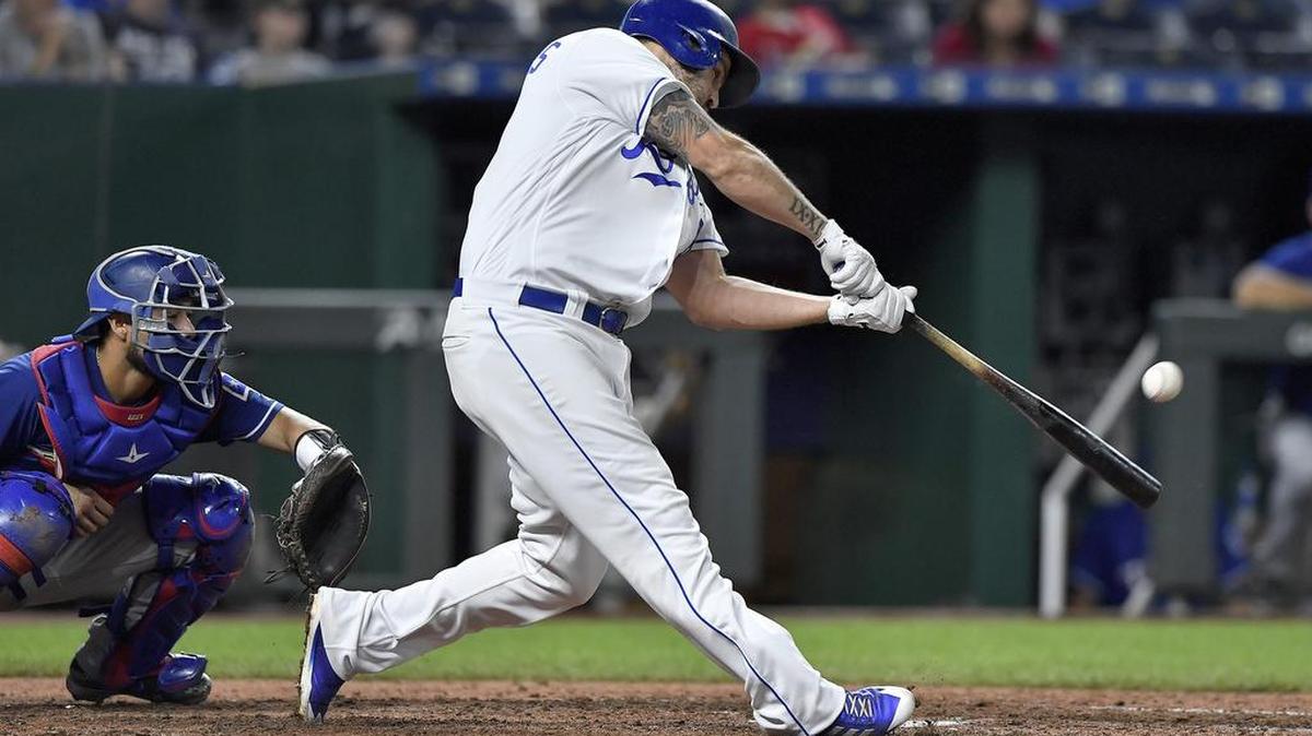 Royals third baseman Mike Moustakas connects on a solo home run during a game against the Texas Rangers last month at Kauffman Stadium.
