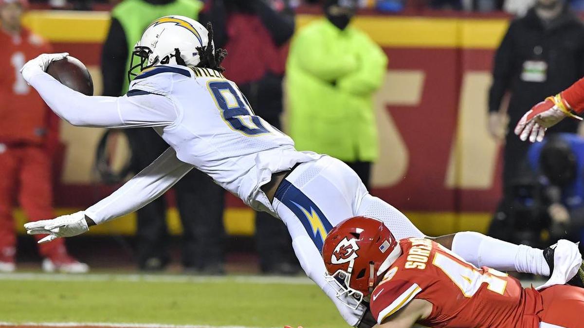 Los Angeles Chargers wide receiver Mike Williams scores a touchdown as Kansas City Chiefs defensive back Daniel Sorensen tries to catch him in the third quarter of Thursday’s football game on December 13, 2018 at Arrowhead Stadium in Kansas City, Mo.