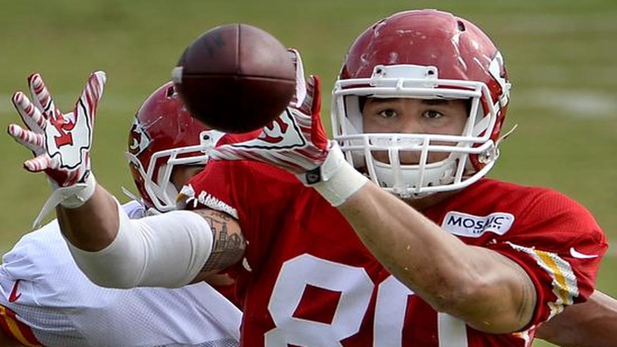
Tight end James O'Shaughnessy kept his focus on the ball as linebacker Frank Zombo closed in during drills on Sunday, Aug. 9, 2015, at Chiefs training camp in St. Joseph.
