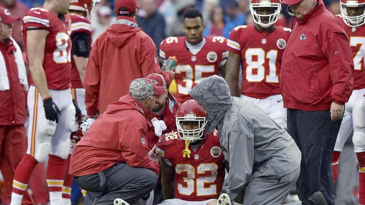Kansas City Chiefs running back Spencer Ware (32) sits up before coming out of the game with an injury in the second quarter during Sunday's football game against the San Diego Chargers on December 13, 2015 at Arrowhead Stadium in Kansas City, Mo.