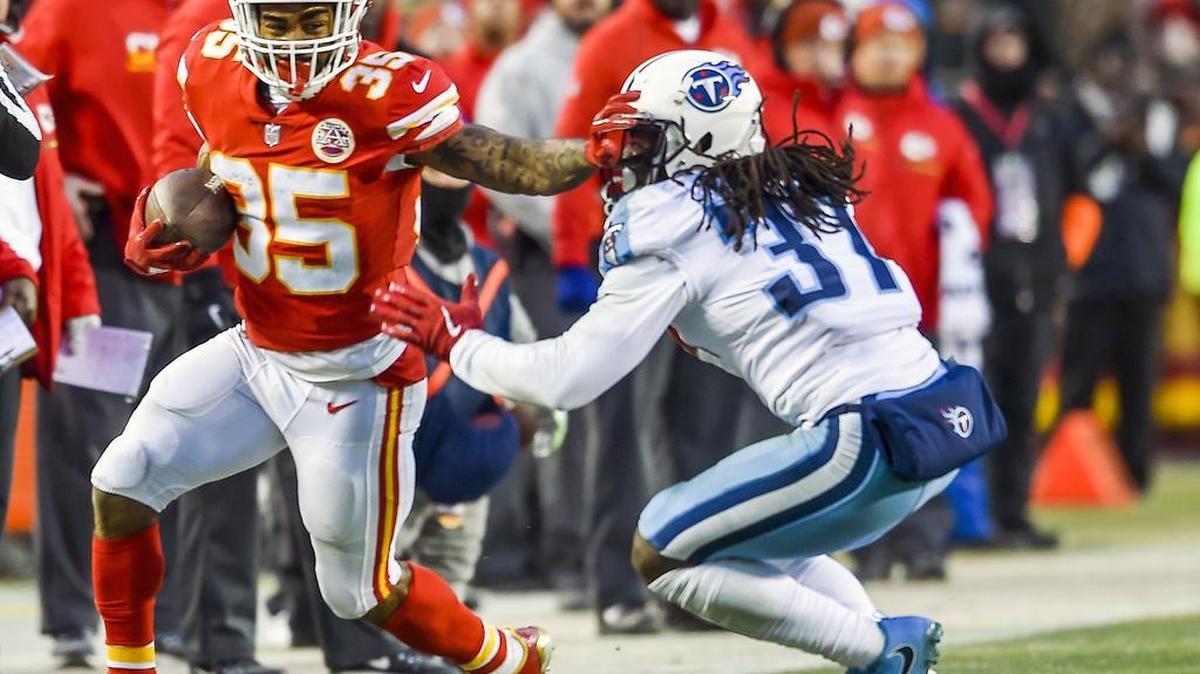 Kansas City Chiefs running back Charcandrick West (35) got past Tennessee Titans strong safety Johnathan Cyprien (37) on Saturday during the second quarter of the NFL Wild Card game in Arrowhead stadium.