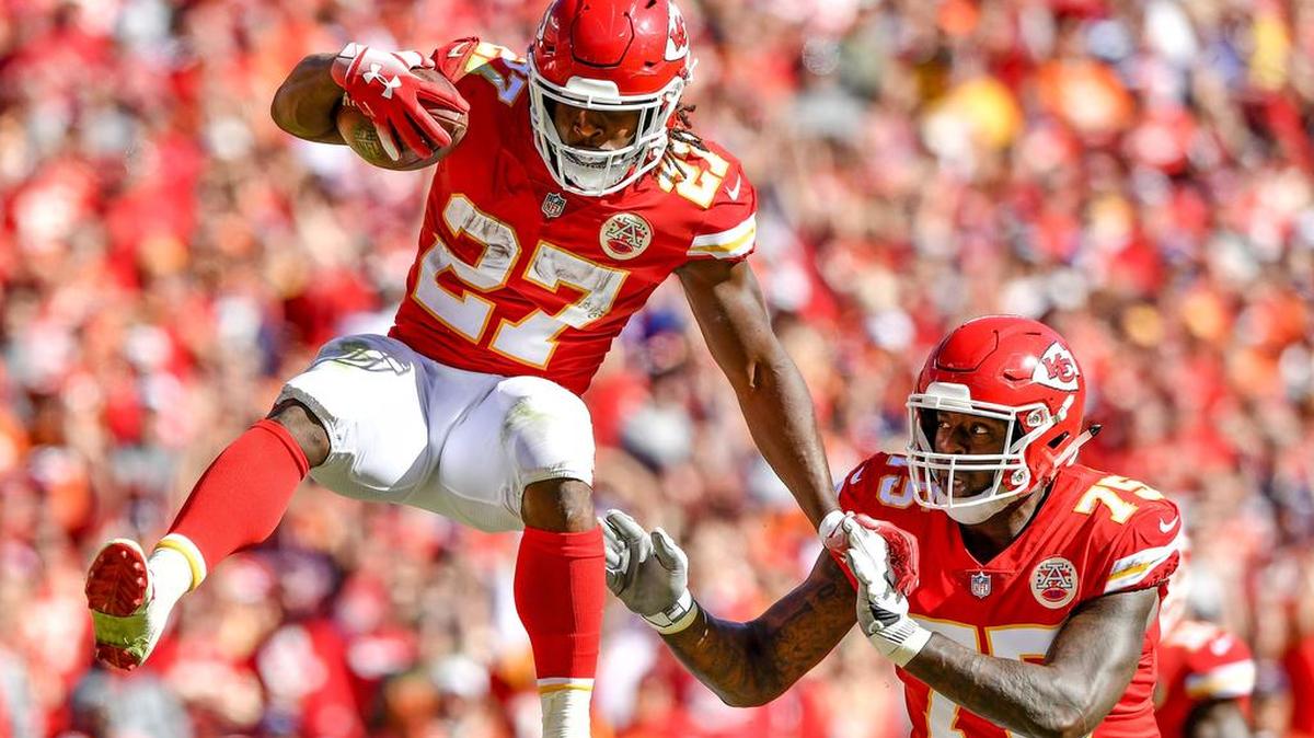 With blocking by Kansas City Chiefs offensive guard Cameron Erving, running back Kareem Hunt made a giant leap over the Denver defense and continued to battle for a 23-yard touchdown run in the third quarter during Sunday’s football game on October 28, 2018 at Arrowhead Stadium in Kansas City, Mo.