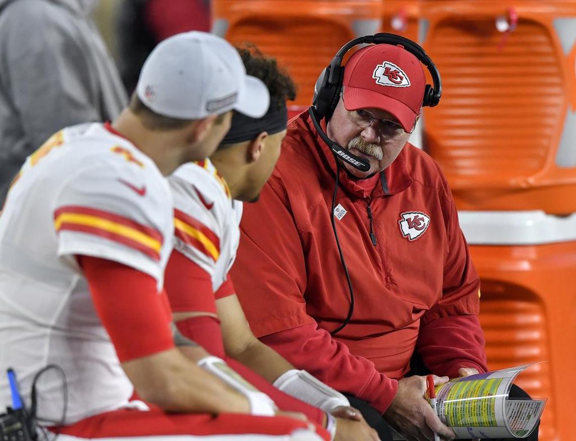 Kansas City Chiefs head coach Andy Reid (right) talks with quarterback Patrick Mahomes (center) during the second quarter of Sunday’s football game on October 14, 2018, at Gillette Stadium in Foxborough, Mass.
