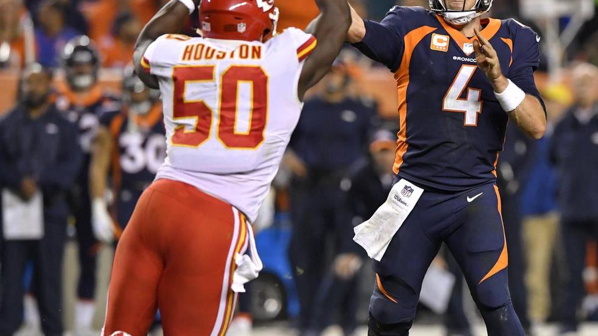 Kansas City Chiefs linebacker Justin Houston forced Denver Broncos quarterback Case Keenum to rush and pass and throw short of a first down late in the second quarter during the game Monday, October 1, 2018 at Mile High Stadium in Denver, Colorado.