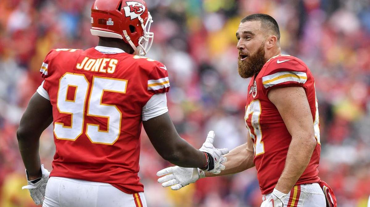 Chiefs tight end Travis Kelce, right, congratulates defensive tackle Chris Jones after Jones intercepted a pass for a touchdown during a 2018 home game against the Jacksonville Jaguars.