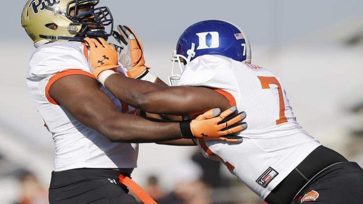 
Duke lineman Laken Tomlinson (right) has been doing a pretty good job this week of pushing people around at workouts for Saturday’s Senior Bowl.


