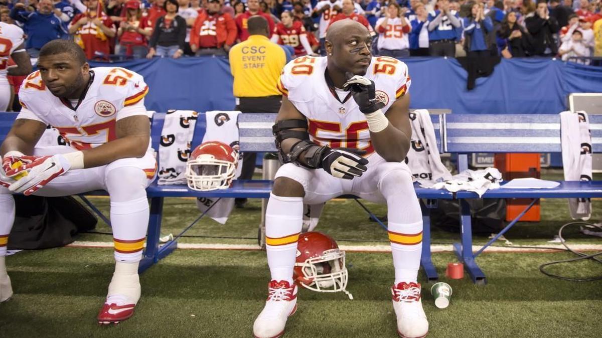 Kansas City Chiefs outside linebacker Justin Houston (50) and Kansas City Chiefs inside linebacker Nico Johnson (57) sat on the bench in the final seconds of the 45-44 loss to the Indianapolis Colts during the AFC Wild Card Game on January 4, 2014 at Lucas Oil Stadium in Indianapolis, Ind.