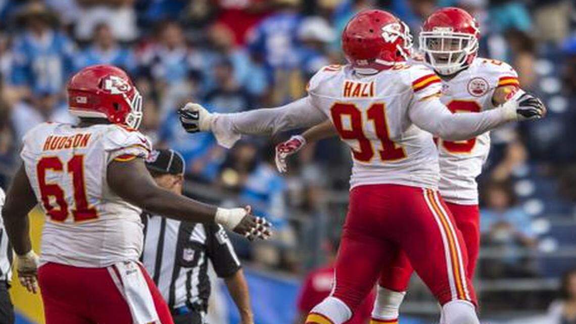 
Kansas City Chiefs cornerback Phillip Gaines (23) jumped into the arms of Kansas City Chiefs outside linebacker Tamba Hali (91) in celebration on the final play of the game after Gaines intercepted San Diego Chargers quarterback Philip Rivers to end the game, 23-20, at Qualcomm Stadium in San Diego, CA on October 19, 2014.

