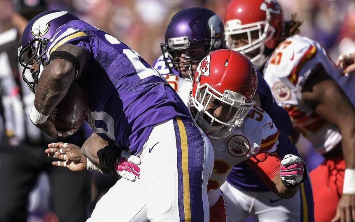 
Kansas City Chiefs inside linebacker Derrick Johnson tackled Minnesota Vikings running back Adrian Peterson in the second quarter on Sunday at TCF Stadium in Minneapolis. The Vikings won, 16-10.
