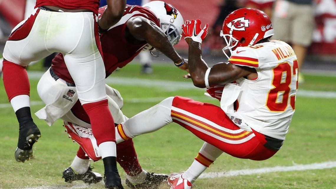 
Chiefs receiver Fred Williams (83) makes a touchdown catch in front of the Cardinals' Gabe Martin (left) during Saturday’s NFL preseason football game in Glendale, Ariz.
