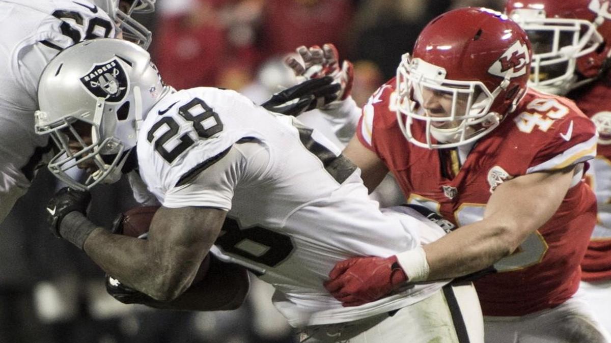 Oakland Raiders running back Latavius Murray was taken down by Kansas City Chiefs defensive back Daniel Sorensen during a game in January.