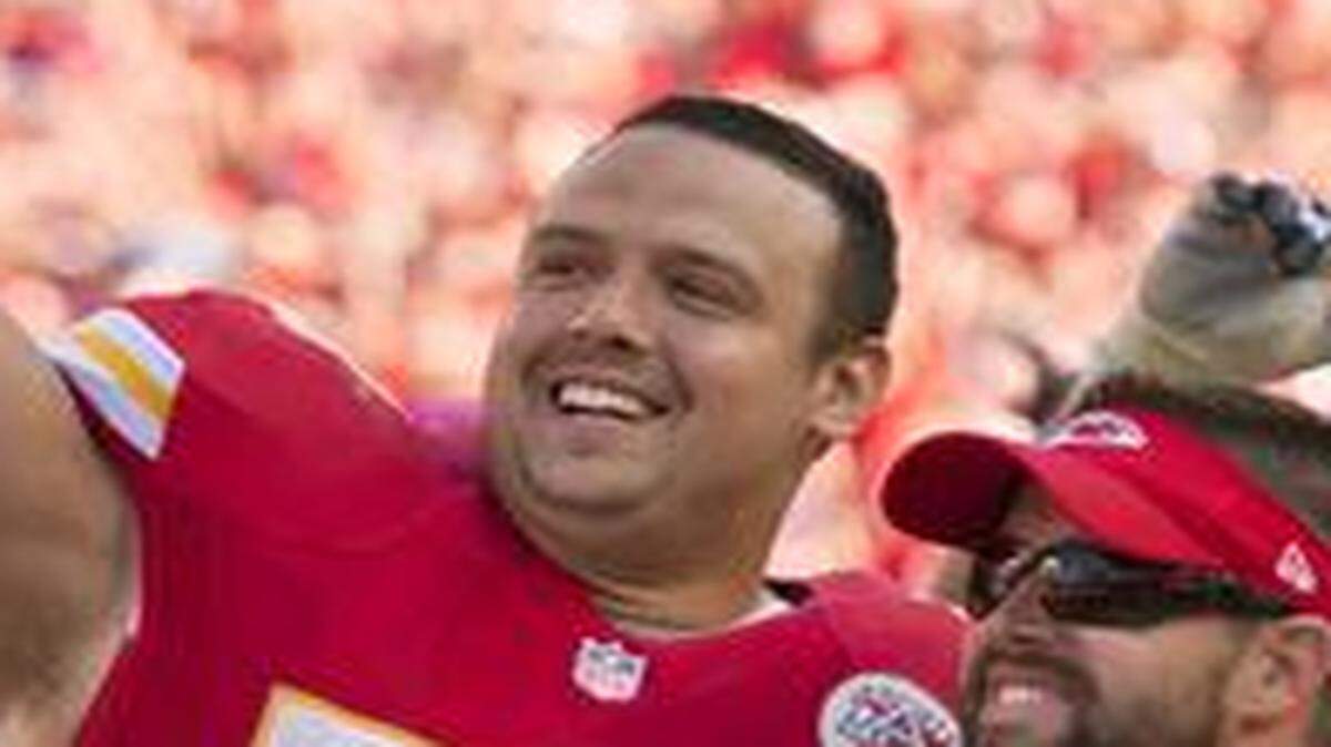 
Kansas City Chiefs defensive end Mike DeVito (70) celebrated with former teammate Jon Asamoah (73) in the final minute of the 24-7 victory over the Oakland Raiders in NFL action on October 13, 2013, at Arrowhead Stadium in Kansas City, Mo. DeVito expects to play against the Titans on Sunday.
