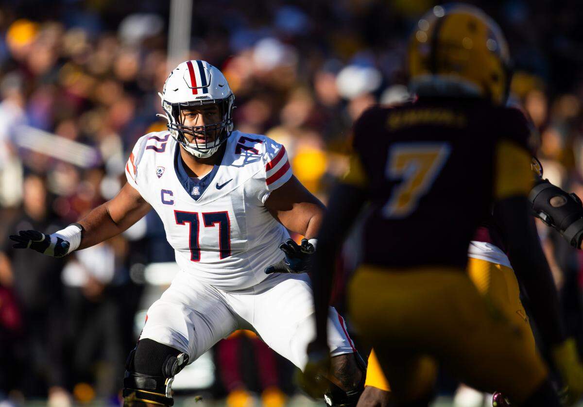 Arizona Wildcats offensive lineman Jordan Morgan (77) against the Arizona State Sun Devils during the Territorial Cup at Mountain America Stadium on Nov. 25, 2023 in Tempe, Arizona.