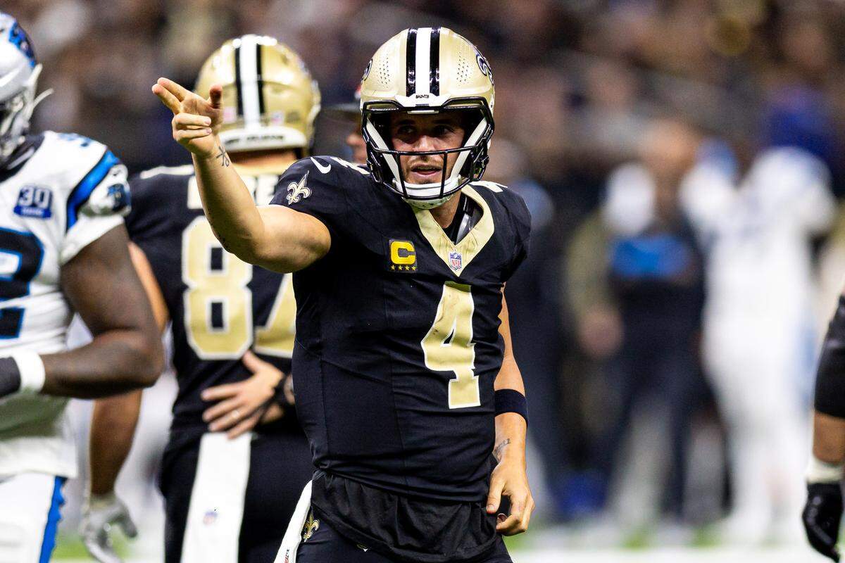New Orleans Saints quarterback Derek Carr (4) reacts to rushing for a first down against the Carolina Panthers during the second half on Sept. 8, 2024 at Caesars Superdome in New Orleans.
