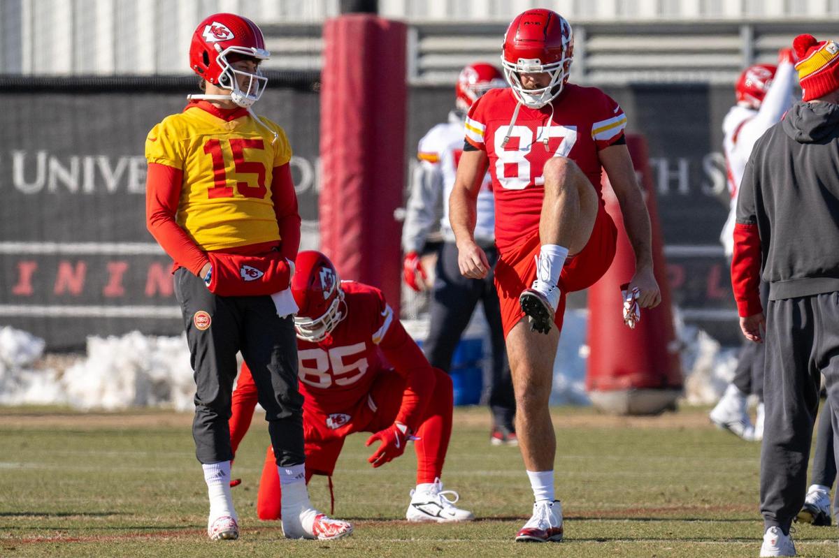 Kansas City Chiefs quarterback Patrick Mahomes (15) and tight end Travis Kelce (87) warm up during practice at the Chiefs’ training facility on Wednesday, Jan. 15, 2025, in Kansas City.